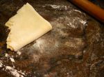 Then folding the pie crust in half again for transferring it to the plate