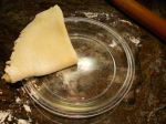 Transferring the pie crust to the plate