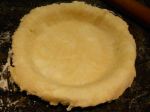 The unfolded pie crust in the plate